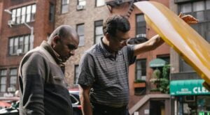 men-checking-car-engine